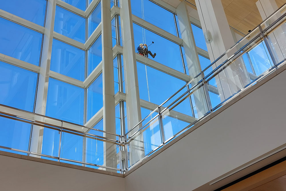 Professional lobby glass cleaning during winter in Rochester NY